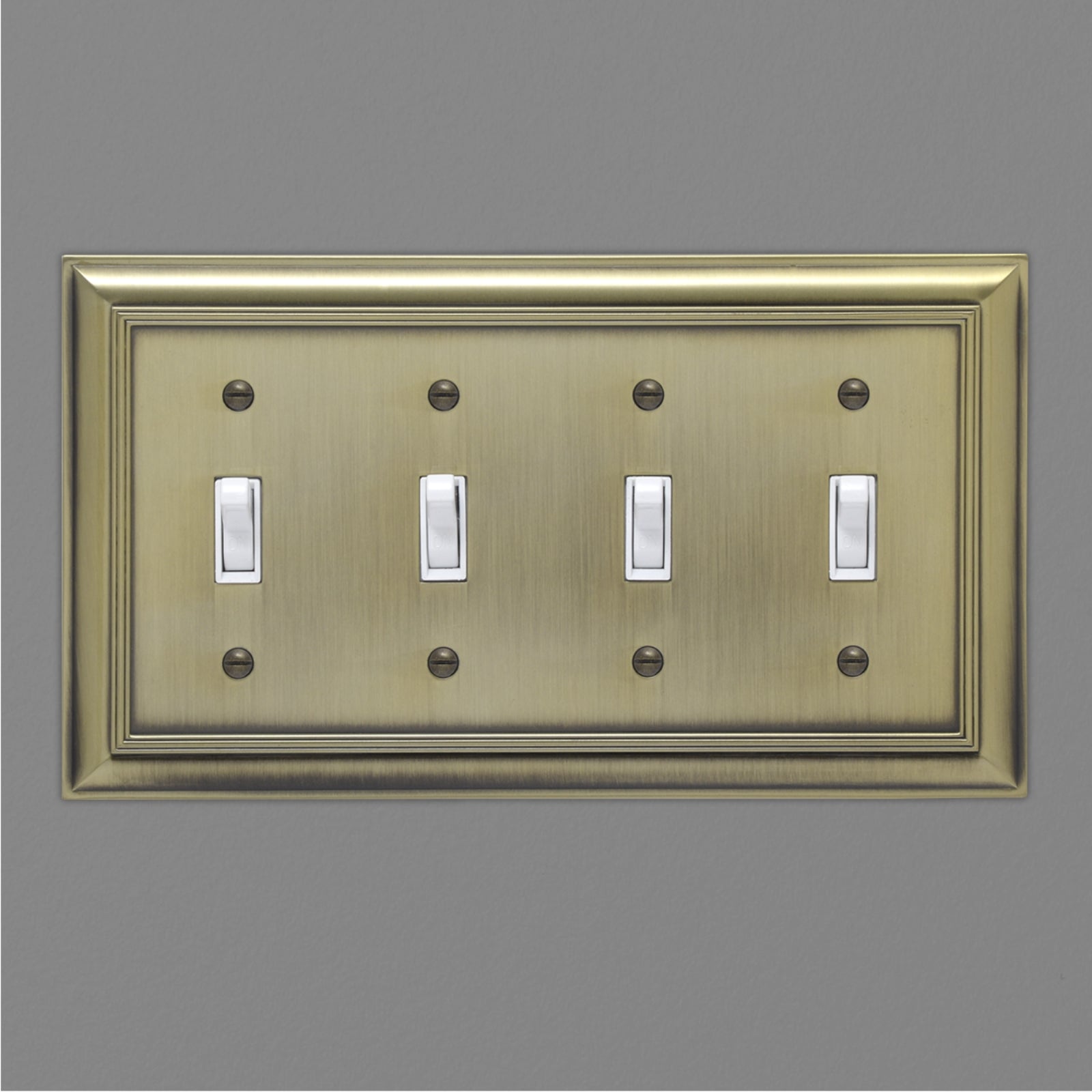 AmazonBasics Quadruple Toggle Wall Plate, Antique Brass, 1-Pack